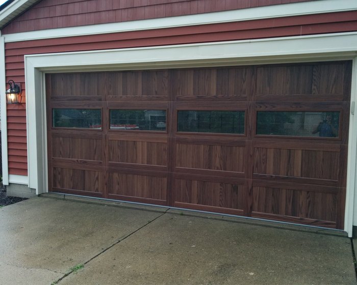 Woodgrain CHI garage door with glass windows